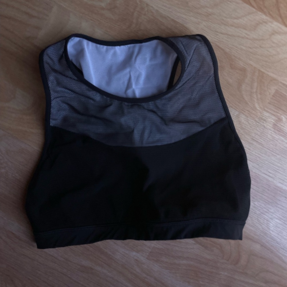 Lululemon black with net sports bra. Excellent used condition size 4